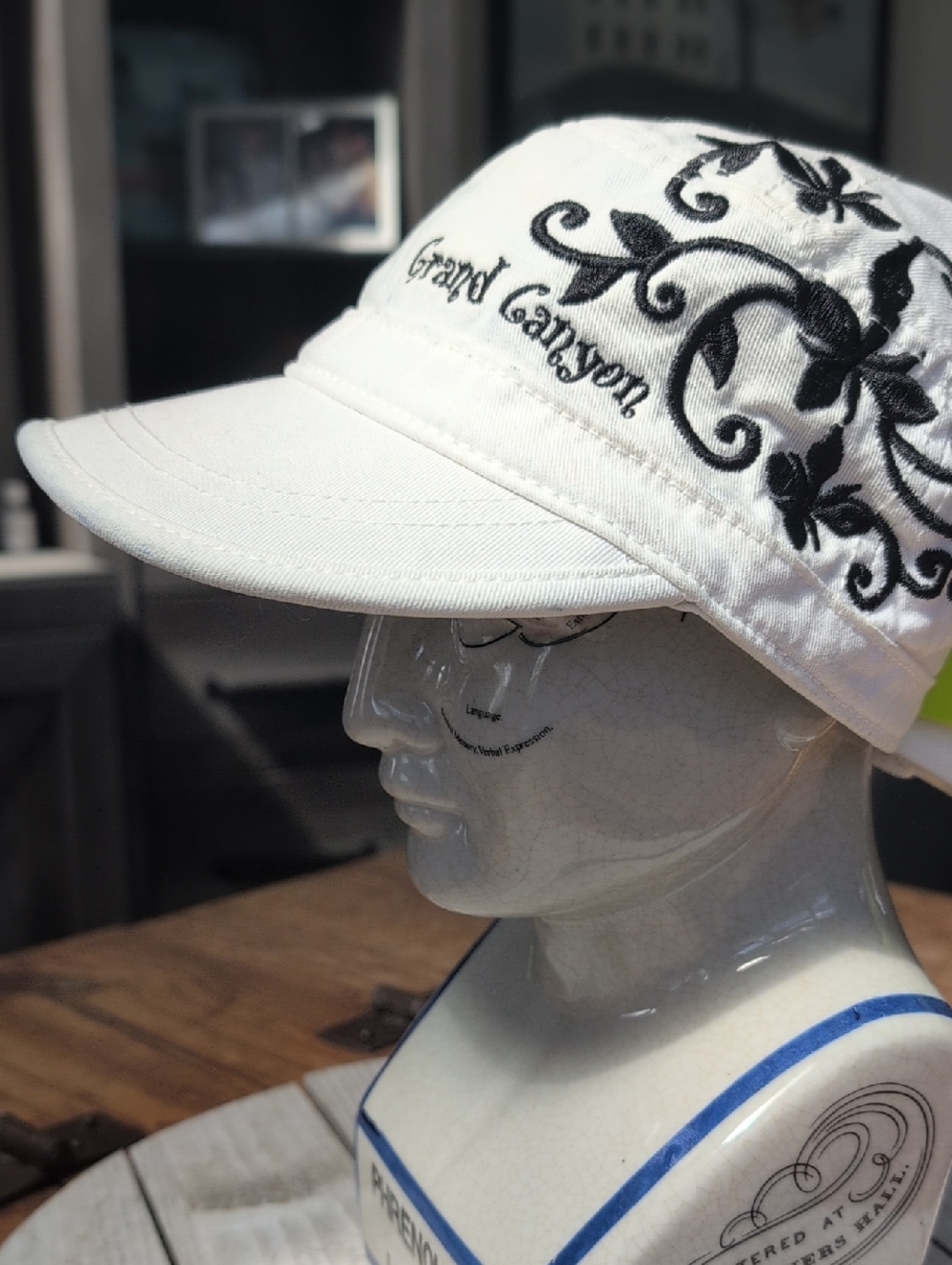 White Cap with Black Floral Embroidery